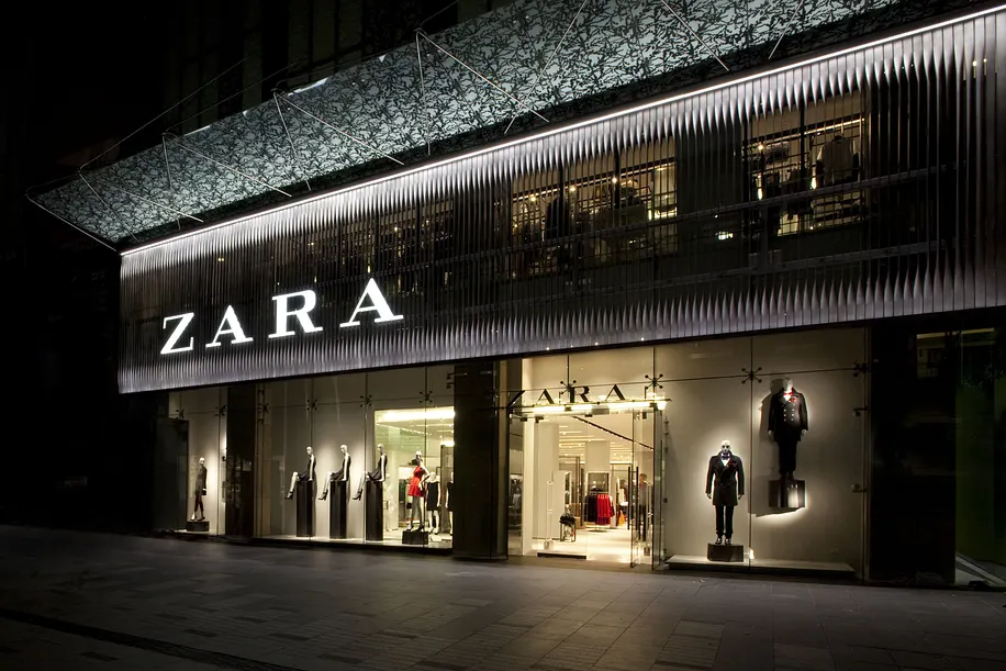 Zara store exterior featuring modern minimalist architecture with floor-to-ceiling windows